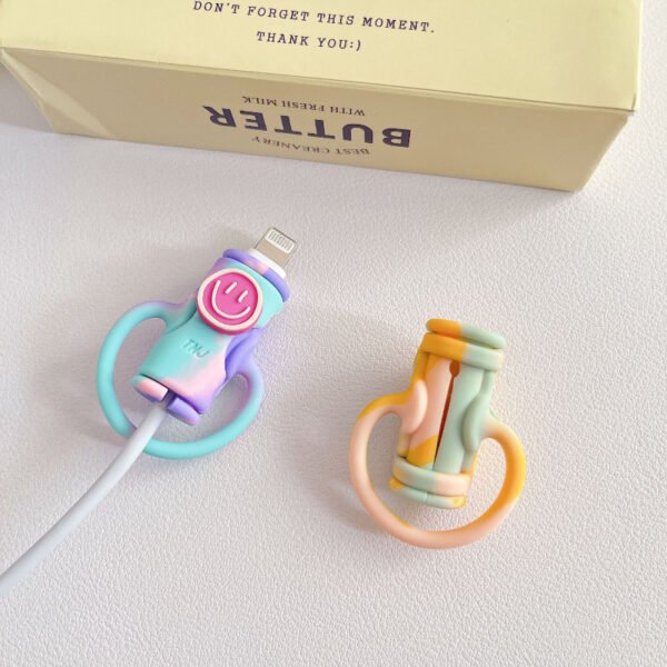 4ce647e070c8496c85978f8bd32e1a48-goods.jpeg Smiling Mixed-Colour Silicone Data Cable Protector Set – 2 Pieces